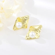 Show details for Famous Medium White Stud Earrings
