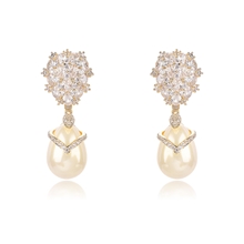 Show details for Nickel Free Gold Plated White Dangle Earrings with Easy Return